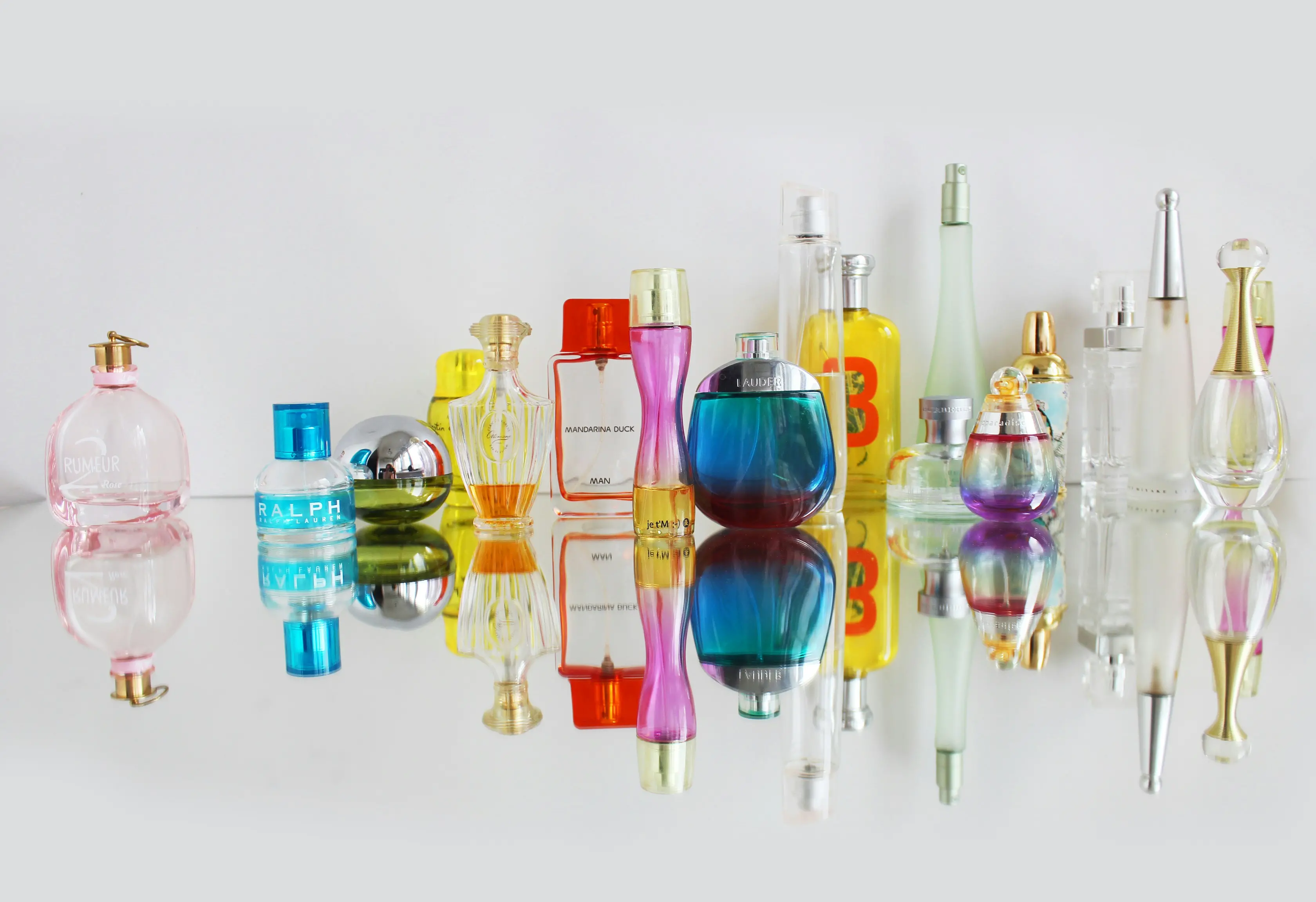 Elegant collection of diverse perfume bottles, showcasing luxury and variety.